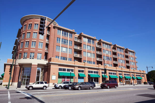 Apartments-with-Retail-Outlets-Insurance Brick building with apartments and shops
