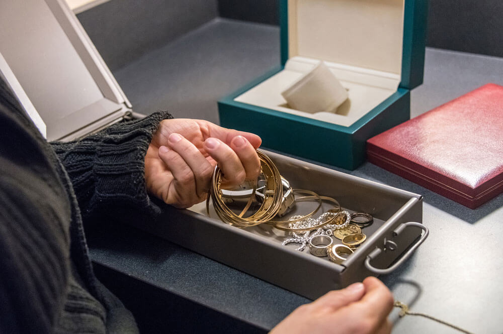 Hands in a jewelry box